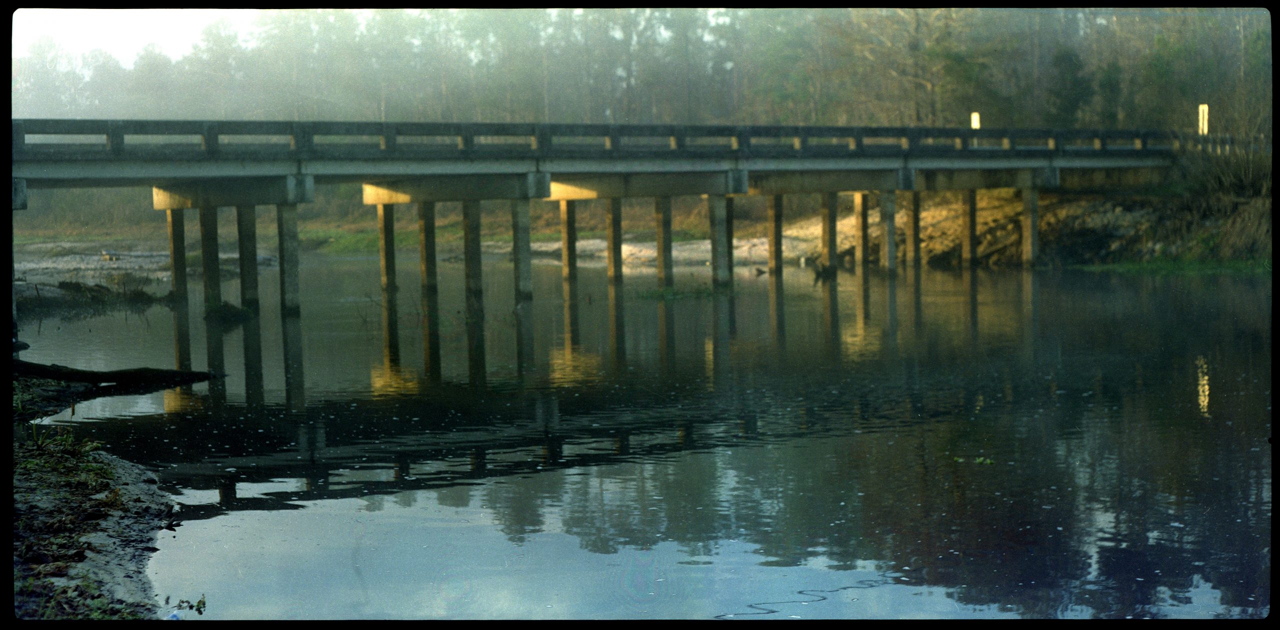 bridge over water at dawn